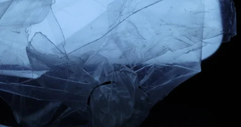 Transparent sheet in blue light Macro shot Stock Footage 313006119