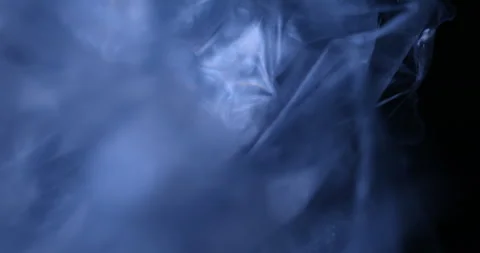 Transparent sheet in blue light Macro shot Stock Footage 327346560