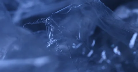 Transparent sheet in blue light Macro shot Stock Footage 327346568