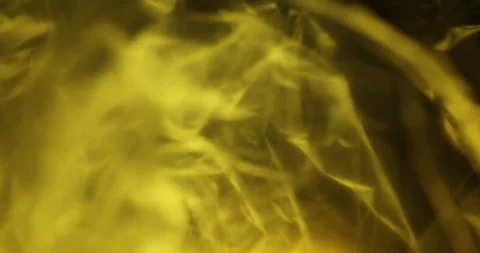 Transparent sheet in Yellow light Macro shot Stock Footage 313194054