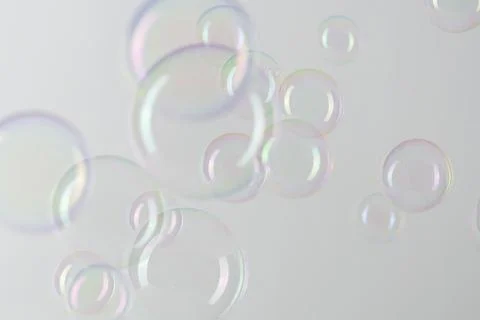Transparent soap bubble pattern on a gray background Stock Photos