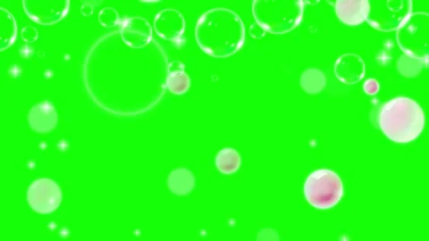 Transparent soap bubbles floating upwards against a bright green screen Stock Footage 345807350