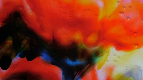 Transparent space liquid is filled with drops of red, blue, yellow and green Stock Footage 169657087