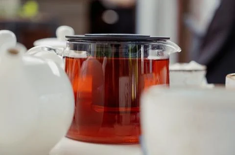 Transparent teapot on the table.Close up Stock Photos