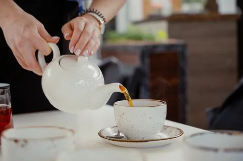 Transparent teapot on the table.Close up Stock Photos