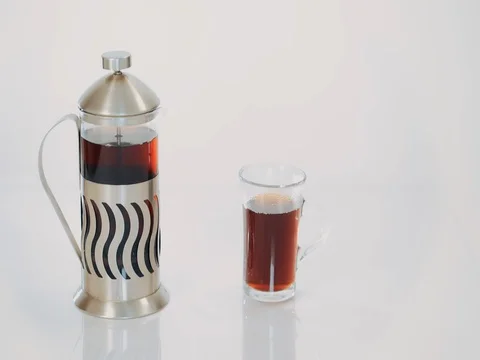 Transparent teapot with tea and a Cup with hot tea on white background 動画素材 73803480