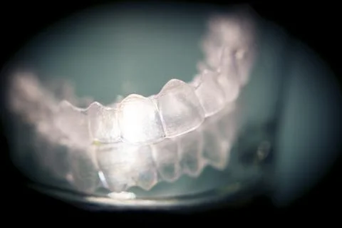 Transparent tooth aligner inside a crystal glass Foto stock