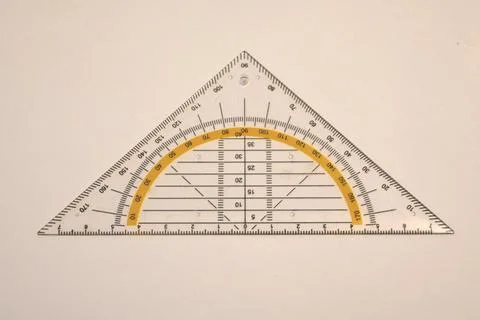 Transparent triangular ruler with angle markings Stock Photos