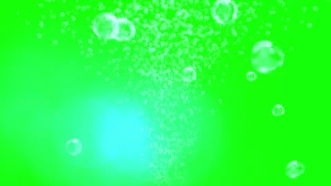 Transparent water bubbles rising upward against a solid green screen background Stock Footage 345807390