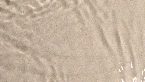 Transparent water surface ripples texture motion, waves, splash, sand background 動画素材 200701292