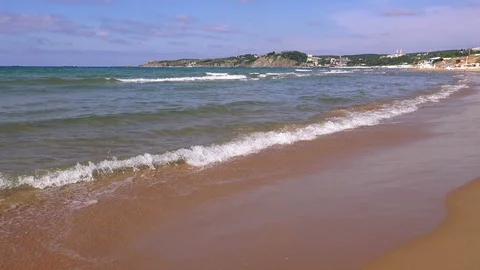 Transparent waves roll on a sandy beach,  Turkey Video stock 96087004