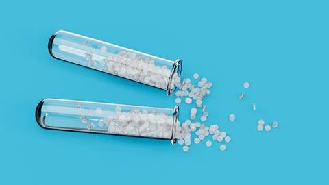 Transparent white Polymer Plastic bead on blue background polymer resin in .. Stock Photos
