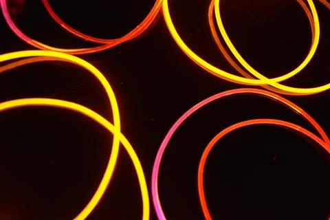 Transparent wire, polyethylene tubes, rods with red, pink, orange, yellow. 스톡 사진