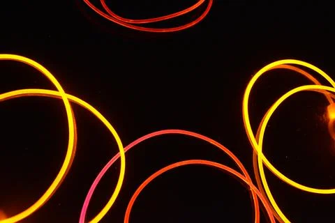 Transparent wire, polyethylene tubes, rods with red, pink, orange, yellow. Foto stock