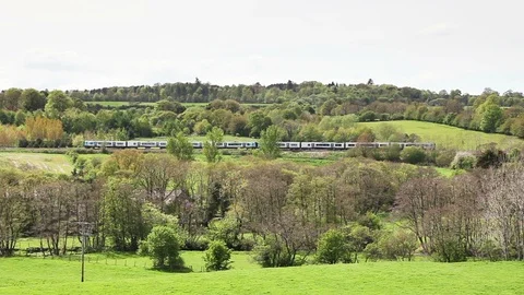 A TransPennine Express Train Heads Through Southwaite, Cumbria in England Stock Footage 89699084