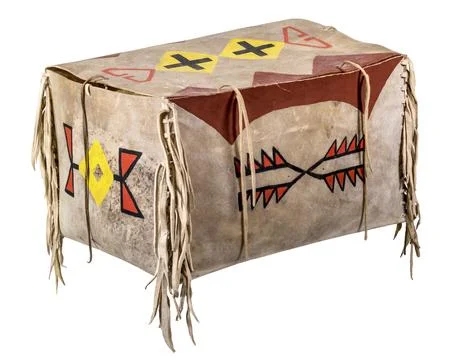 Transport box made of rawhide painted Indian with leather cords painted on white Stock Photos
