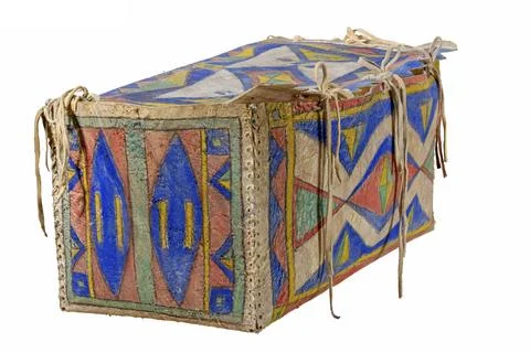 Transport box made of rawhide painted Indian with leather cords painted on white Stock Photos