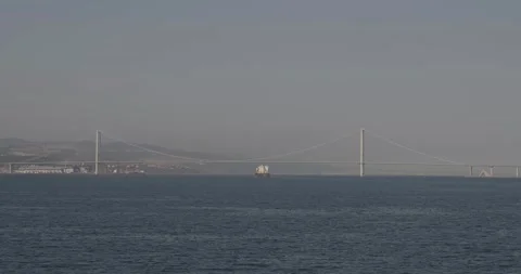 Transport ship passes under a cable suspension bridge called Osmangazi Koprus Video stock 134879750