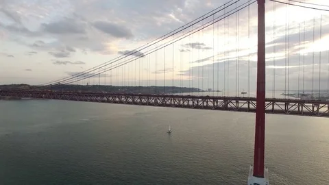 Transportation on 25 April bridge in Lisbon at evening Stock Footage 80280459