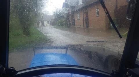 The transportation and mobilty in a tractor during a rainshower Stock Photos