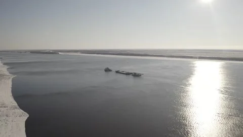 Transportation of a barge about the river upstream. Autumn, Siberia, Russia Stock Footage 143422684