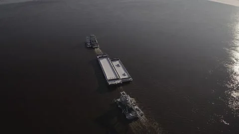 Transportation of a barge about the river upstream. Autumn, Siberia, Russia Stock Footage 143422687
