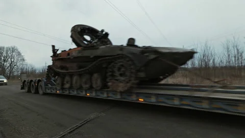 Transportation of blown-up Russian tanks Stock Footage 200917239
