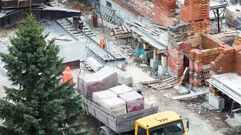 Transportation of bricks from a truck to construction Stock Footage 137086544