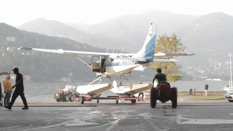Transportation of the floatplane in lake como by two man Video stock 127823771
