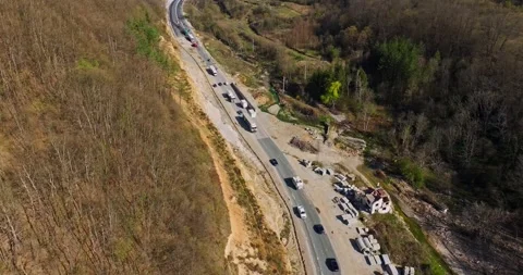 Transportation Infrastructure New Road Development Heavy Traffic Aerial Follow Stock-Footage 300477033