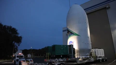 Transportation of NASA's PACE sateliite to Launch Complex 40 at dusk Stock Footage 295928995