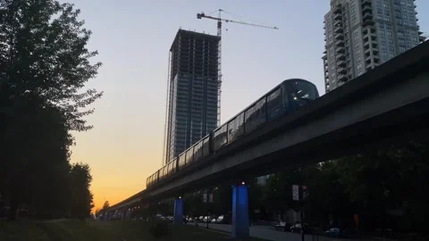 Transportation Skytrain Sunset with buildings Stock Footage 281916752