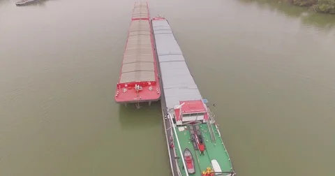 Transporting barges traveling side by side on Danube River transport traffic Stockbeeldmateriaal 71249074