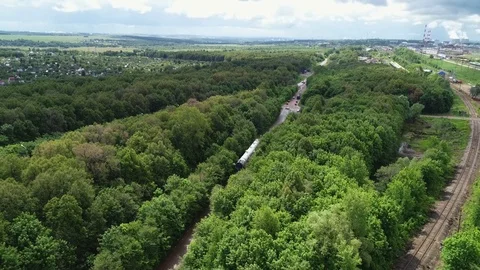 Transporting a large pipe / reactor on a road through a forest on a summer day. Stock Footage 124244708