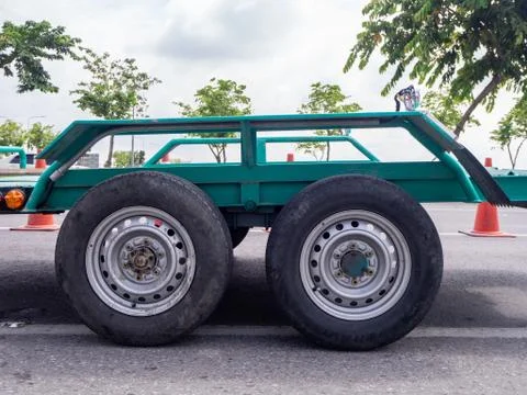 Transporting small  cargo trailer for a car strapped Stock Photos