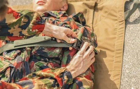 Transporting the wounded soldier. Stock Photos