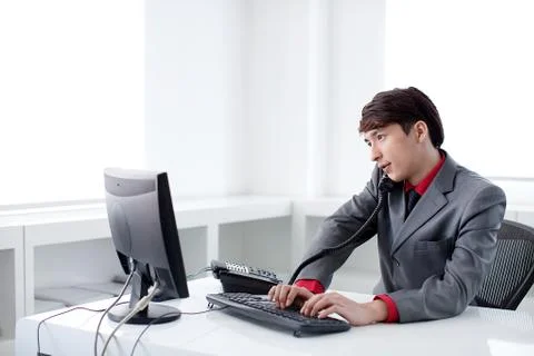 Transverse composition Call. Manager Typing Work The Blue Man of the Year a man Stock Photos