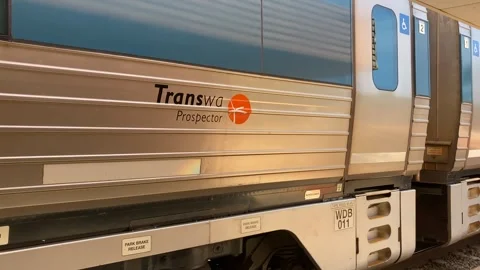 TransWA Prospector passenger train logo departing rural Western Australia Video stock 311349714
