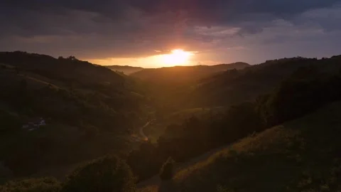 Transylvania mountain valley at dramatic sunset after rain, with mist lifting fr Stock-Footage 324950455