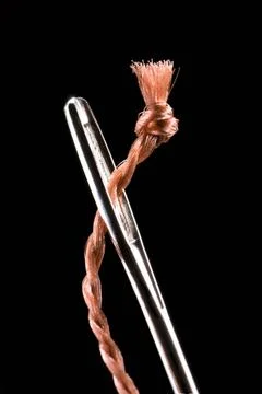 Trap Metal needle and string. Very much a close up. Black background. Copy... Stock Photos