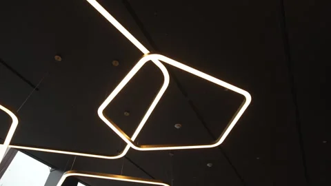 Trapezoid lamps accent cafe interior with stylish contrast Видео 326445973