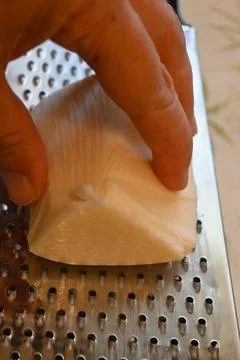 Trapist cheese on a grater 库存照片