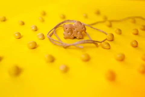 Trapped easter bunny cookie on yellow background Stock Photos