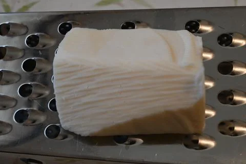 Trappist cheese on a grater Stockfoto's