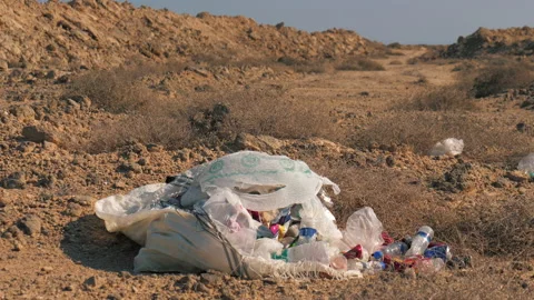 Trash abandoned in desert, plastic pollution and environment pollution Stock Footage 172044550