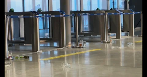 Trash and empty bottles scattered near the gate in the port of Helsinki Stock Footage 305583451