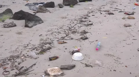 Trash and junk on the beach environmental pollution 스톡 동영상 48570181