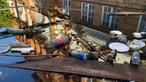 Trash are seen floating in the waters of Negro river, Manaus, Amazon, Brazil 4K Stock Footage 155233177