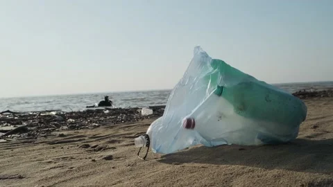 Trash bag full of plastic garbage on a sandy beach, close-up. Stock Footage 195009151