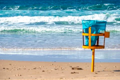 Trash basket with a disposable garbage bag standing on the Mediterranean coas Stock Photos